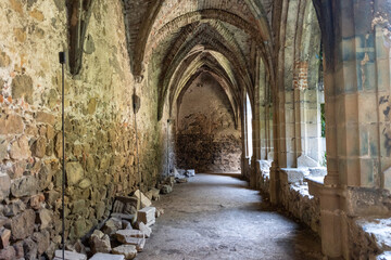 Old stone corridor in the abbey. Interior of Rosa Coeli Cathedral in the Czech Republic.