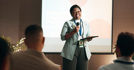 Business woman, workshop and training for speaker in seminar room for wellness presentation. Conference, forum speech and microphone with corporate coach on stage for public relations or development