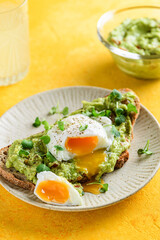 bruschetta with guacamole sauce and poached egg