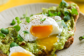 bruschetta with guacamole sauce and poached egg