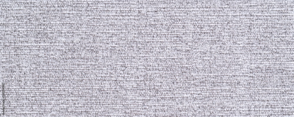Poster a textured gray surface filled with densely packed text, creating an intricate pattern that resemble
