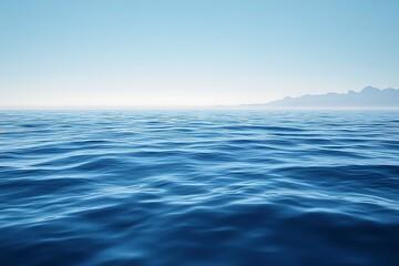 Obraz premium a serene expanse of deep blue ocean stretching to the horizon, meeting a clear, light blue sky, creating a calming and tranquil seascape perfect for conveying peace and vastness