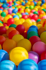 Many colorful plastic balls from a ball pool.