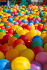 Many colorful plastic balls from a ball pool.