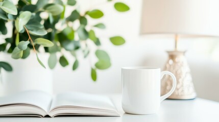 Cozy home office setup with open book, white mug, and greenery for relaxed reading and working environment