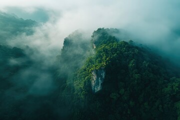 Aerial View of Misty Green Mountain Landscape in Foggy Weather