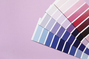 Different paint color palettes on light purple background