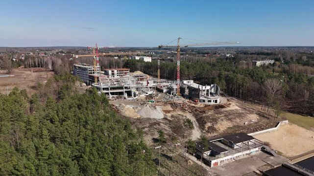 Construction of a large complex on the riverbank.