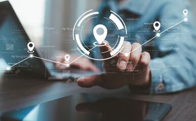 Man using laptop with virtual world and model map with location point , GPS app, icon Travel maps and find places in the online system, all screen graphics are generated,Searching for travel.