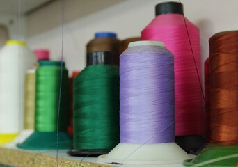 Colorful yarn on spool, yarn on tube, cotton, wool, linen thread