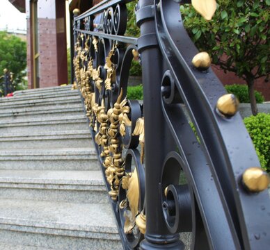 Black wrought iron gelender with golden details. Entrance to the Moscow Hotel, Belgrade , Serbia. Image