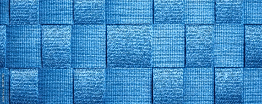 Poster a textured blue fabric with woven squares, creating a visually appealing pattern that showcases dept