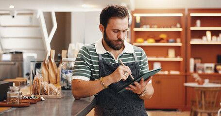 Employee, stylus and man in coffee shop, tablet and friendly service with digital app for menu. Person, restaurant host and business owner in cafe, technology and internet with email for online order