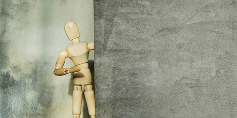 Wooden Art Mannequin Posing Curiously Near Wall