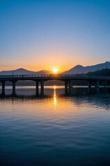 Fototapeta premium arafed bridge over a body of water with a train on it