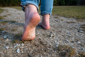 celebrating go barefoot day by walking without shoes