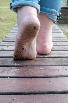 celebrating go barefoot day by walking without shoes
