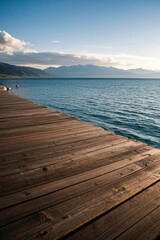 Fototapeta premium there is a wooden dock that is next to the water