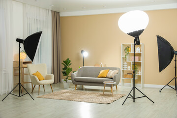 Professional photo studio equipment prepared for shooting living room interior