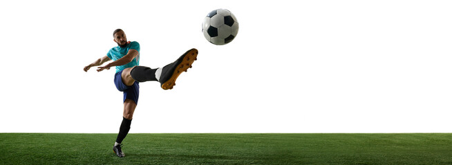 Banner. Explosive motion capture of skilled footballer delivering forceful shot, cleats striking...