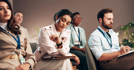 Conference, bored and audience of business woman check time for presentation, seminar and convention. Professional, corporate and men and women with watch for meeting, training event and workshop