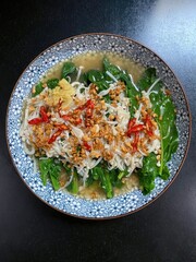 A colorful plate of cooked vegetables and garnish served to eat