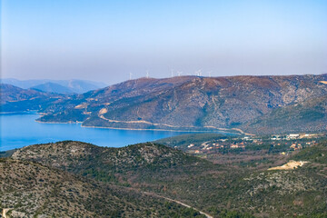 Aerial panorama view of a mountain with Wind Farm in the distance near Dubrovnik, Dalmatia region, Croatia 