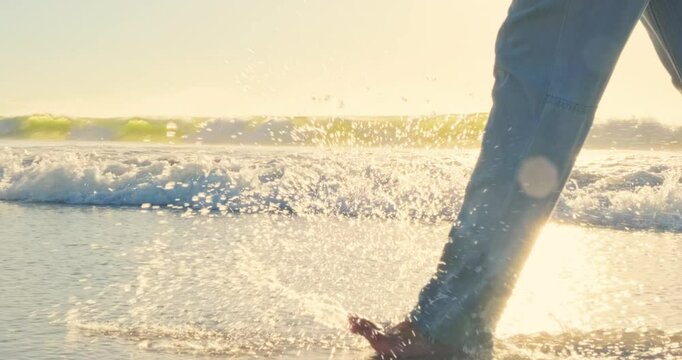 4k video of Feet, beach and sunset. Walking on sand with sea in backdrop 4k footage