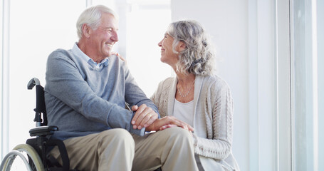 Holding hands, wheelchair and senior couple in home for bonding, empathy or trust for support....