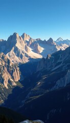 Majestic Dolomites mountain panorama, sunlit peaks and valleys, blue, Dolomites
