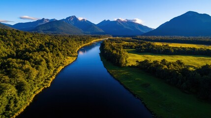 Serene river winds through lush valley