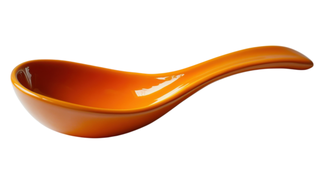 Stylish ceramic spoon rests elegantly on a surface showcasing vibrant orange color