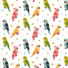 Children's seamless pattern with budgies of green, pink, blue and yellow colors, with feathers on the head of a pink parrot