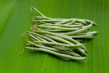 Fresh needle beans on banana leaves