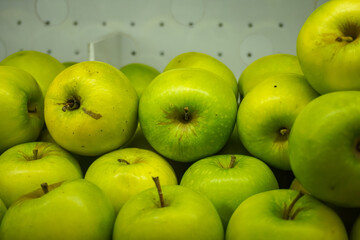 View of fresh green Apples on a fruit shop shelf. Healthy apples.