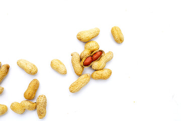 Roasted peanuts in shell on white background.
