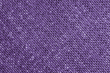 Upholstery purple colored jacquard fabric diagonal coarse weave texture close up, macro. Textile background, furniture textile material, wallpaper, backdrop. Cloth structure close up, macro