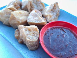 tofu food stuffed with meatballs with chili sauce