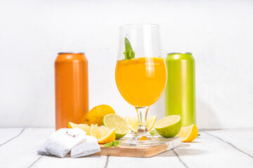 Trendy Tea Inspired cocktail set from green, oolong, black, chai and other tea blends. Sparkling tea soda, cold summer drinks with syrup, lemon, lime and mint, on sun lighted white wooden background
