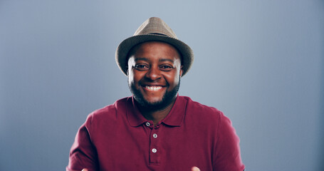 Space, happy or portrait of black man in studio with confidence, mockup or humor. Comedian, comic...