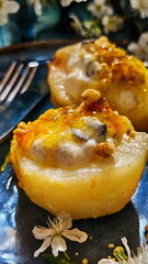 Poached pears with mascarpone on a blue background