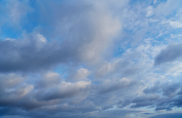 Cumulus clouds slowly float across the blue sky, reflecting the natural harmony of nature. Symbolizes peacefulness and relaxation.