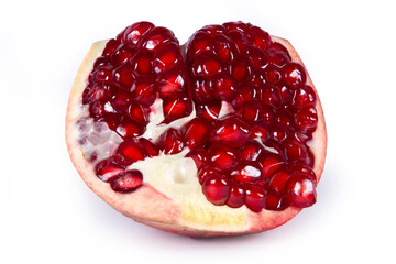 Half of pomegranate fruit isolated on white background.