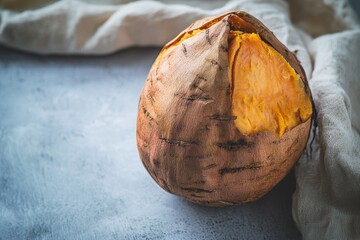 Freshly Cooked Sweet Potato on Gray Surface with Natural Lighting