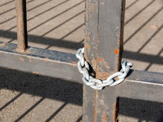 The iron gates are chained shut.