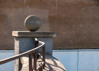 Stone sphere as a decorative element of fencing.
