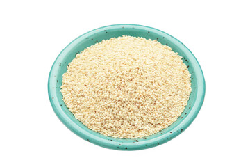 Raw sesame seeds in plate isolated on white background.