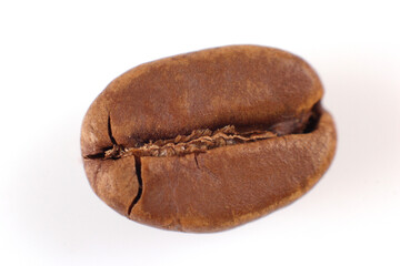 Macro shot of a roasted coffee bean with a textured, cracked exterior on a white backdrop. Great for coffee packaging or gourmet food visuals.