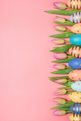 Card of Easter Day. Easter eggs with tulips on a yellow background