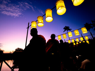 Silhouette of Monks at Dawn with Lanterns